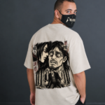 Back view of ANIMURA Eren and Grisha Yeager Beige Oversized Anime T-Shirt featuring black and white Eren and Grisha Yeager manga artwork